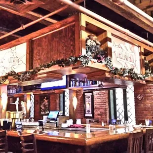 Upon entering and moving toward the dining rooms, there is a bar.
