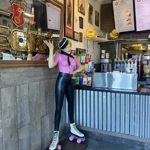 a woman in a pink top and black leggings