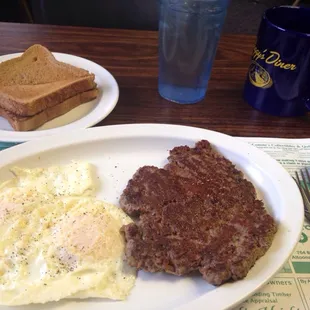 Hamburger steak, eggs, toast and coffee.  Ordered without home fries