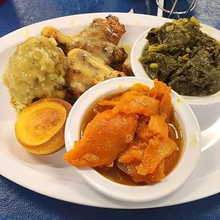 Chicken and dressing, sweet potatoes and greens.