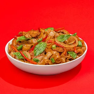 a bowl of stir fried noodles