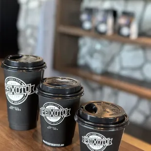 three cups of coffee on a table