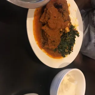 a plate of food and a bowl of yogurt