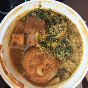 Egusi, okra, tripe, chicken, and cow feet