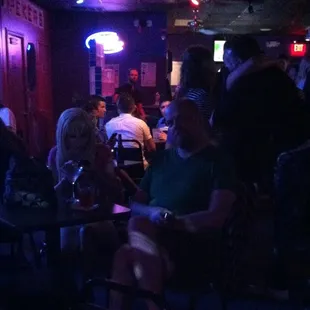 a group of people sitting at tables