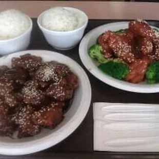 a tray of food including rice, meat and broccoli