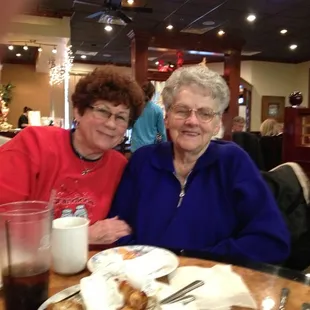 two women sitting at a table