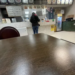 a woman standing at the counter