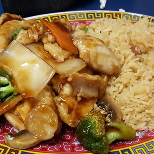 a plate of food with rice and vegetables