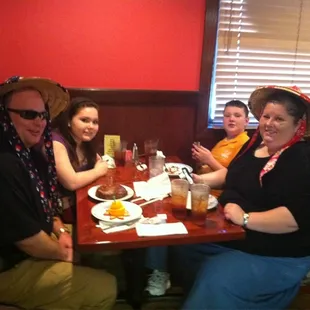 a group of people sitting at a table