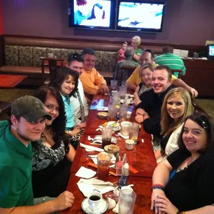 a group of people sitting at a table