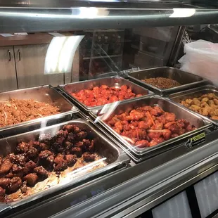 a variety of food items in a display case