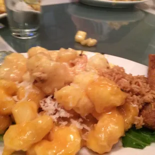 Coconut and walnut shrimp with fried rice and egg roll.