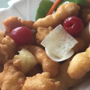Sweet and sour chicken, comes with cherries, onions, pineapple, bell pepper and onion