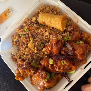 Orange chicken with fried rice and an egg roll