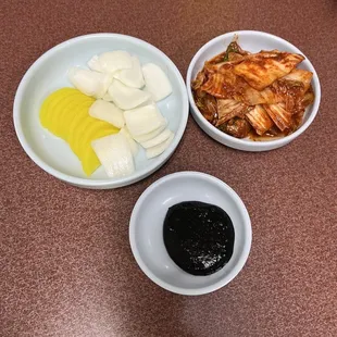 two bowls of food on a table