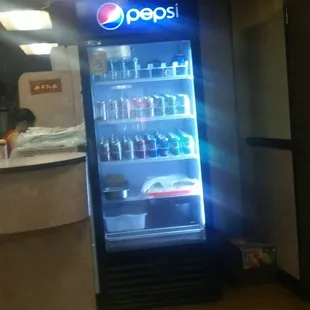 a pepsi vending machine in a restaurant