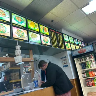a man ordering food at a restaurant