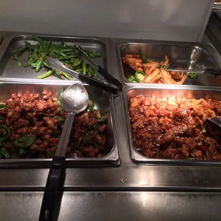 a variety of food items in a buffet