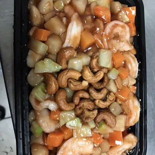a black container of food on a table