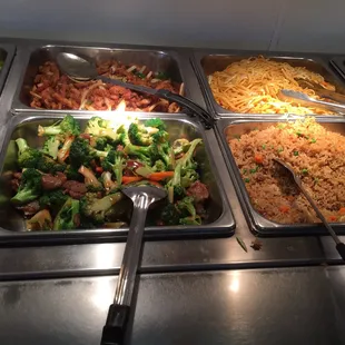 a variety of food items in a buffet