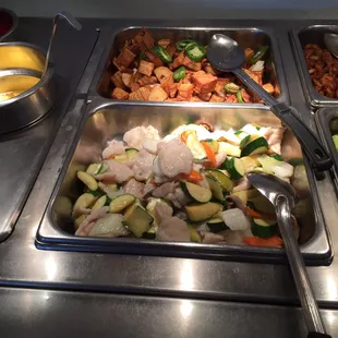 a variety of food items in a buffet