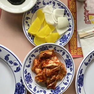 Top dish takuan (yellow radish), &amp; onions.  The bottom dish excellent kimchi (the best I ever had)