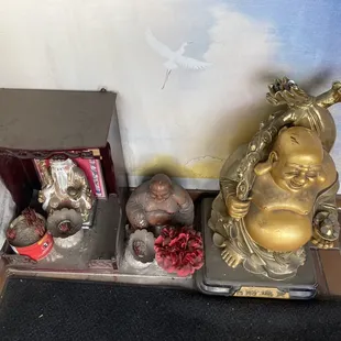 a statue of a laughing buddha