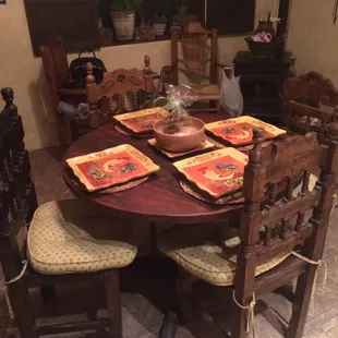 Casita kitchen table charmingly set with Spanish style plates