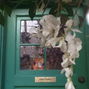 Outdoor dining area is ringed by doors formerly used for specific purposes