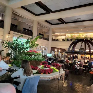 people sitting at tables in a restaurant