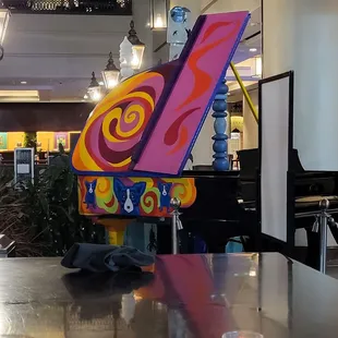 a colorful piano in a restaurant