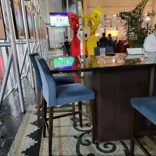 a man sitting at a table with a laptop