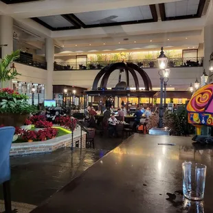 people sitting at tables in a restaurant