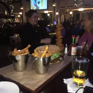Who-dat 5 pound burger with fries and onion rings from Pelican Bar Sheraton Hotel New Orleans Canal Street