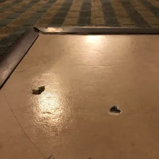 Very dirty and old carpet and tile.