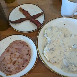 Biscuits and gravy, side of ham, side of bacon