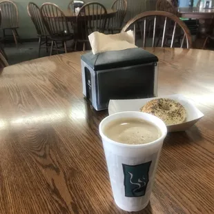 a cup of coffee and a bagel
