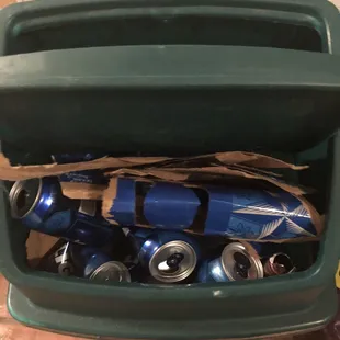 a cooler filled with cans