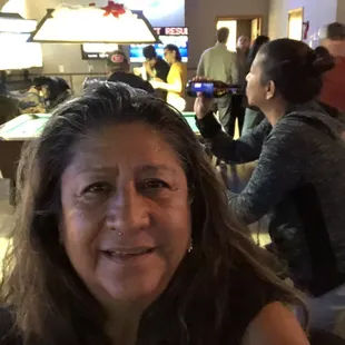 a woman sitting at a bar