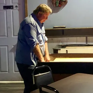 a man standing in a kitchen