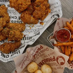 Left: crispy wings signature &amp; soy sauce Right: peli cheese balls &amp; sweet potato fries