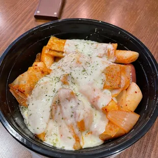 a bowl of pasta and cheese