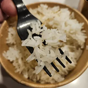 Cheap, bad quality, old rice. Like eating bits of white plastic.