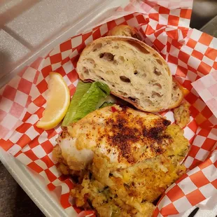 Excellent broiled stuffed grouper, with a side of garlic bread. The cornbread stuffing was also great!