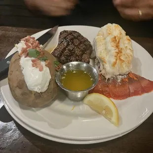 Steak and lobster with baked potato