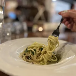 a plate of pasta with a fork