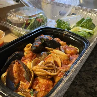 a tray of pasta and clams