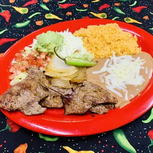 Carne Asada- grilled 8oz sirloin steak served with rice, beans and tossed salad.