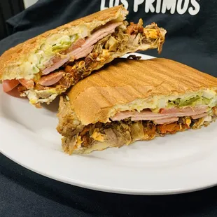 Torta Cubana- carnitas, Al pastor, sausage franks and ham.